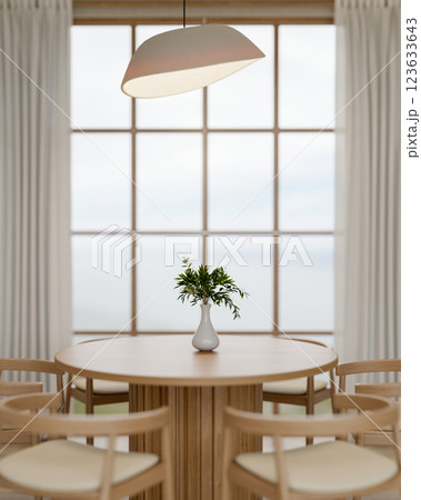 A wooden round table with chair place beside the large wall window. Cosy dining room interiors. A wooden round table with chair place beside the large wall window. Cosy dining room interiors. 123633643