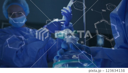 Image of chemical formula over diverse surgeons and patient in hospital Image of chemical formula over diverse surgeons and patient in hospital 123634138