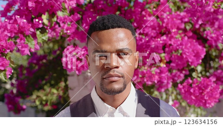 Portrait of happy african american man looking at camera and smiling, slow motion 123634156