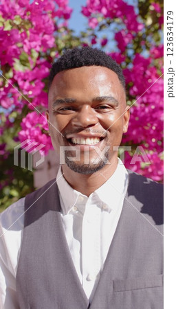 Vertical image of portrait of happy african american man looking at camera and smiling Vertical image of portrait of happy african american man looking at camera and smiling 123634179
