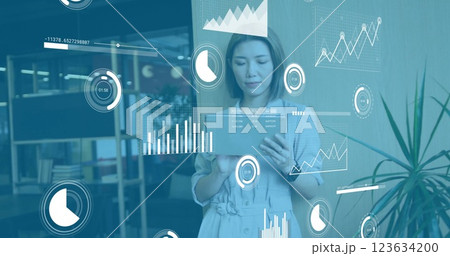 Image of diagrams and data processing over asian businesswoman using tablet 123634200