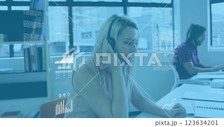 Image of diagrams and data processing over diverse colleagues using phone headsets in office 123634201