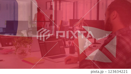Image of flag of wallis and futuna over caucasian businessman using laptop 123634221
