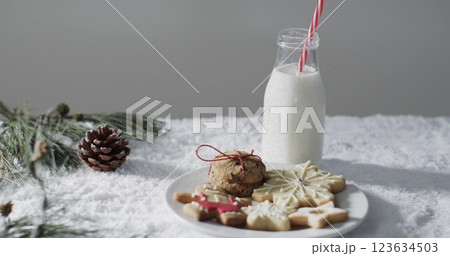 A festive table features cookies and milk, evoking holiday cheer 123634503