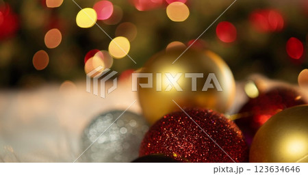 Image of baubles over christmas tree 123634646