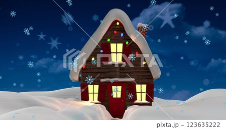 Snowflakes falling over house on winter landscape against blue sky 123635222