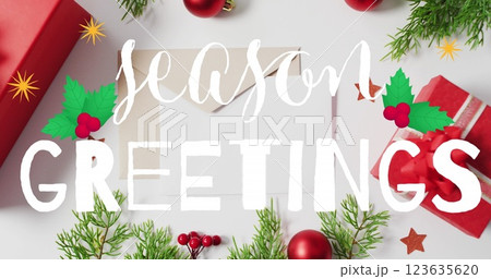A black background with red christmas decorations and envelopes is shown 123635620