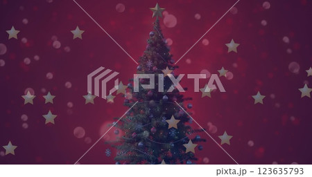 Image of golden stars and spots of light over decorated christmas tree against red background 123635793