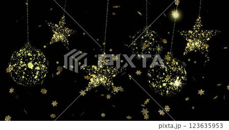 Image of gold snowflakes with star and bauble christmas deocrations hanging on black background 123635953