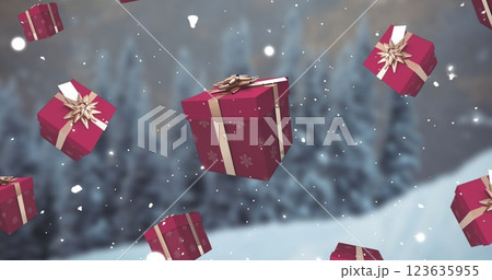 Image of falling snow and red christmas presents over winter landscape 123635955