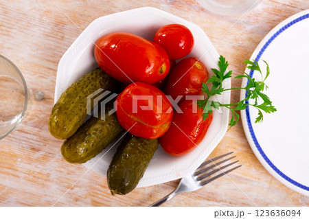 Homemade marinated tomatoes and cucumbers on plate Homemade marinated tomatoes and cucumbers on plate 123636094