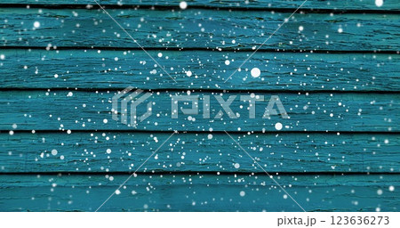 Image of snow falling over blue wooden surface Image of snow falling over blue wooden surface 123636273