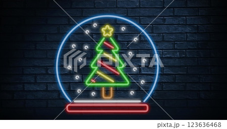 Image of brick wall with christmas tree in snow globe Image of brick wall with christmas tree in snow globe 123636468
