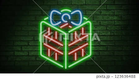 Christmas gift neon sign against copy space on green brick wall Christmas gift neon sign against copy space on green brick wall 123636488