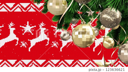 Image of snow falling over christmas baubles and fir tree decoration on red reindeer background 123636621