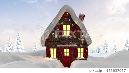 Image of snow falling over christmas decorated house in winter scenery Image of snow falling over christmas decorated house in winter scenery 123637037