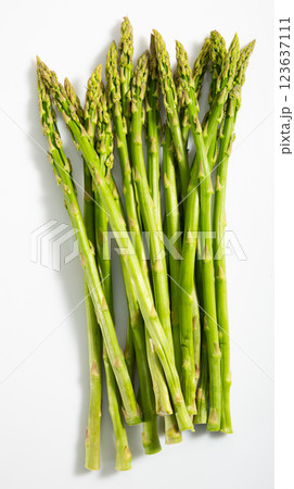 Raw fresh green asparagus isolated on a white background Raw fresh green asparagus isolated on a white background 123637111