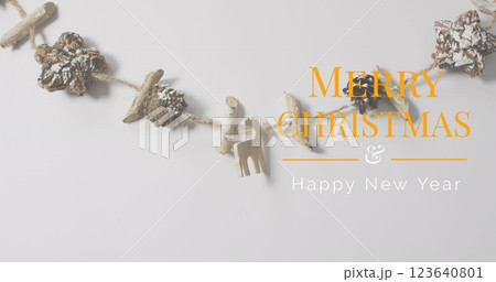Image of christmas greetings text over christmas decorations Image of christmas greetings text over christmas decorations 123640801