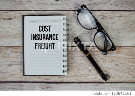 Cost Insurance Freight (CIF) text on notepad, Business and Financial concept background Cost Insurance Freight (CIF) text on notepad, Business and Financial concept background 123641161