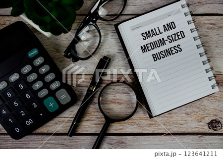 Small and Medium-Sized Business (SMB) text on notepad, Business and Financial concept background 123641211