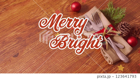 Image of christmas greetings on tag over cupcakes on white background 123641793