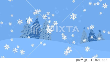 An image of snow falling over christmas trees on a blue background An image of snow falling over christmas trees on a blue background 123641852