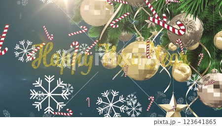 Image of happy holidays text with candy canes and snowflakes falling against christmas tree 123641865