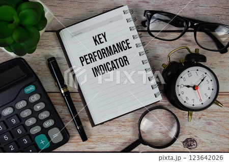 Key Performance Indicator (KPI) text on notepad, Business and Financial concept background 123642026