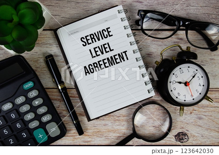 Service Level Agreement (SLA) text on notepad, Business and Financial concept background Service Level Agreement (SLA) text on notepad, Business and Financial concept background 123642030