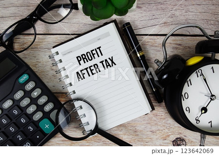 Profit After Tax (PAT) text on notepad, Business and Financial concept background Profit After Tax (PAT) text on notepad, Business and Financial concept background 123642069