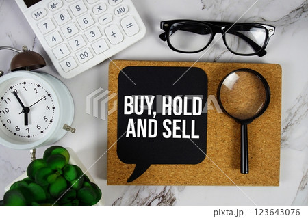 Buy, Hold And Sell text on speech bubble with alarm clock, calculator and magnifying glass on marble background Buy, Hold And Sell text on speech bubble with alarm clock, calculator and magnifying glass on marble background 123643076