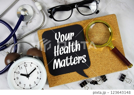 Your Health Matters text on speech bubble with alarm clock, magnifying glass and stethoscope on marble background Your Health Matters text on speech bubble with alarm clock, magnifying glass and stethoscope on marble background 123643148
