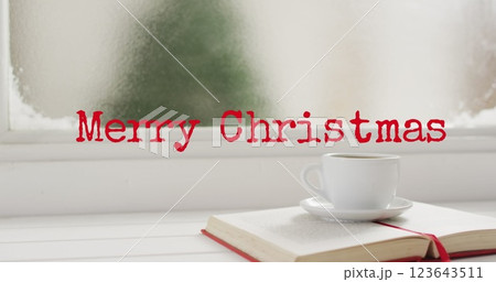 Image of christmas greetings text over open book and cup Image of christmas greetings text over open book and cup 123643511