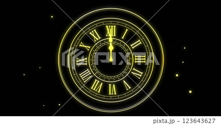 Image of clock showing midnight and fireworks exploding on black background 123643627