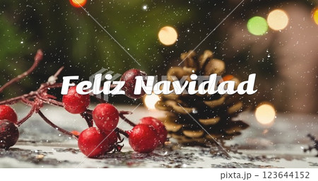 Image of feliz navidad text over snow falling with christmas decorations 123644152