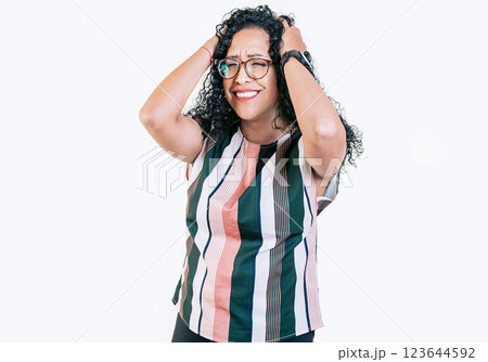 Overwhelmed young woman holding her forehead. Stressed and tired afro woman holding her head isolated Overwhelmed young woman holding her forehead. Stressed and tired afro woman holding her head isolated 123644592