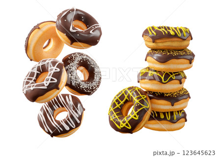 Donuts with chocolate glaze, sprinkles, white drizzle, and dots isolated on white transparent background 123645623