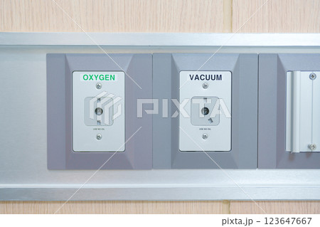 Oxygen and Vacuum Pipeline socket for Patient medical treatment in hospital room. Medical equipment, Emergency, Professional Medical system , Intensive Care Unit and Safety concept Oxygen and Vacuum Pipeline socket for Patient medical treatment in hospital room. Medical equipment, Emergency, Professional Medical system , Intensive Care Unit and Safety concept 123647667