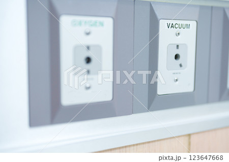 Oxygen and Vacuum Pipeline socket for Patient medical treatment in hospital room. Medical equipment, Emergency, Professional Medical system , Intensive Care Unit and Safety concept Oxygen and Vacuum Pipeline socket for Patient medical treatment in hospital room. Medical equipment, Emergency, Professional Medical system , Intensive Care Unit and Safety concept 123647668