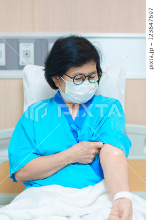 Elderly asian Patient Woman with medical patch plaster after blood test in hospital. Diagnose, illness, treatment, Insurance, Healthcare, medical Examination, Blood donation and World Blood Donor Day 123647697