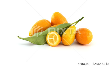 Fresh kumquats with leaves and a half kumquat showing the pulp Fresh kumquats with leaves and a half kumquat showing the pulp 123648218