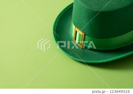 St Patricks day and March 17 concept with green parade Leprechaun Hat with belt on green background. Close up. Copy space. St Patricks day and March 17 concept with green parade Leprechaun Hat with belt on green background. Close up. Copy space. 123649328
