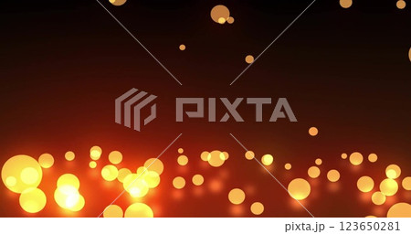 Image of glowing light spots moving over black background 123650281