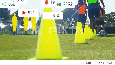 Image of social media notifications over african american male football team training with ball Image of social media notifications over african american male football team training with ball 123650298