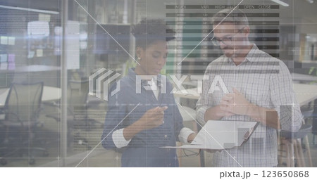 Image of data processing and diagrams over diverse colleagues discussing work in office 123650868