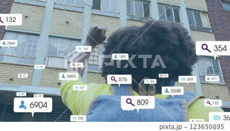 Image of media icons over african american woman wearing backpack 123650895