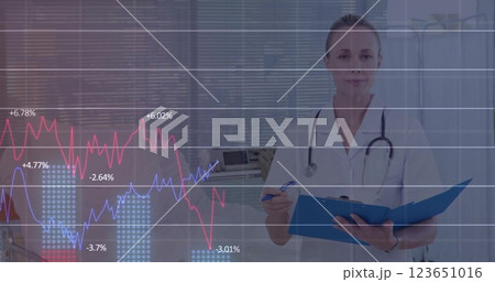 Image of financial data processing over caucasian female doctor Image of financial data processing over caucasian female doctor 123651016