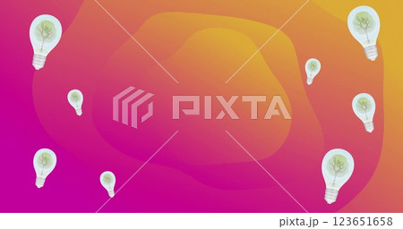 Image of lightbulbs with trees over orange and pink shapes 123651658