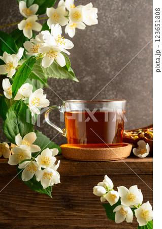 Herbal tea and blooming jasmine branch. Herbal tea and blooming jasmine branch. 123651808