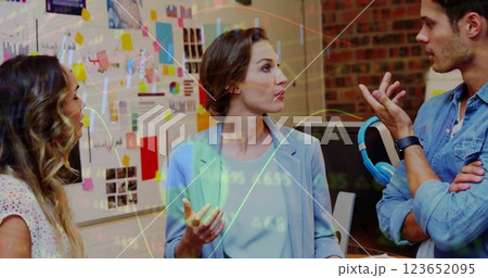 Image of financial data processing over diverse business people in office Image of financial data processing over diverse business people in office 123652095